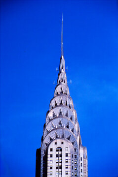 Close up of the silver Art Deco crown and metallic geometric patterns of the Chrysler Building