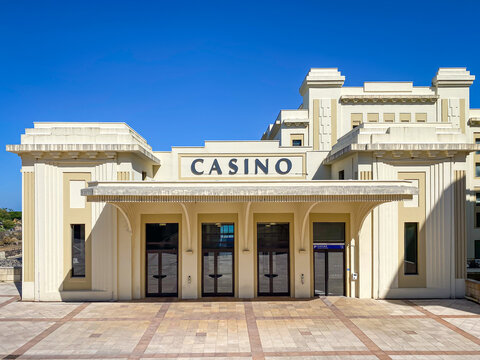 Frontal view of the landmark Casino Barri&egrave;re de Biarritz with its historic Art Deco architecture and paved front courtyard