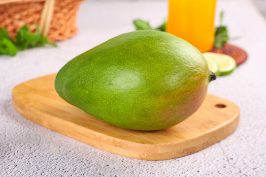Fresh Green Mango from Panzhihua Sichuan on Wooden Cutting Board - Tropical Fruit Kate Variety