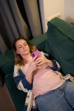 Relaxed Couch Scrolling in a Cozy Evening Mood