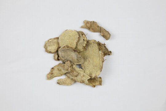 Dried Ginger Root Slices Isolated on White Background