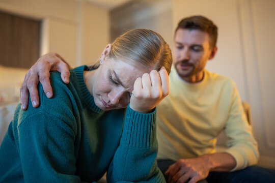 Offended disappointed wife and manipulative narcissistic husband, toxic relationships in marriage, cautious dishonest male partner embracing stressed unhappy woman, guilt and emotional breakdown.