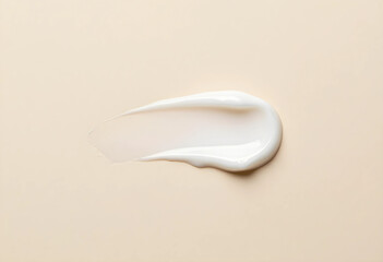 Naklejka premium White cosmetic cream smear or lotion swatch on a light beige background, beauty product texture for skincare and makeup, the smooth