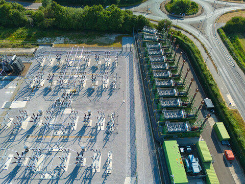 Aerial view of industrial generator compressor units for power generation at small electrical substation