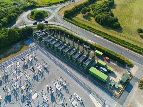 Aerial view of industrial generator compressor units for power generation at small electrical substation