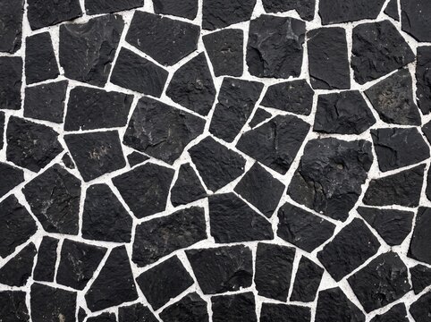 Realistic Top Down Black Basalt Stone Pavement Texture Background with Irregular Polygon Slabs, Bold White Mortar Lines, and Full Frame High Contrast Mosaic Pattern