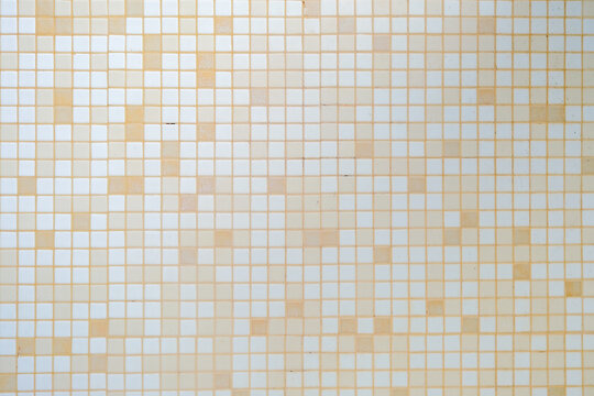 White and orange tile checkered background bathroom floor texture