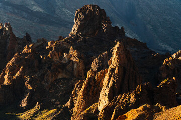 Dramatic rock formations bathed in golden sunlight on Tenerife's volcanic landscape © LCH photo gallery
