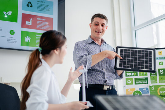 Green Business Meeting Discussing Solar Energy Solutions and ESG