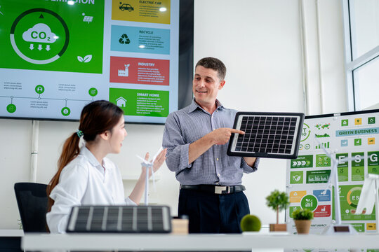 Business professionals discuss sustainable energy solutions and