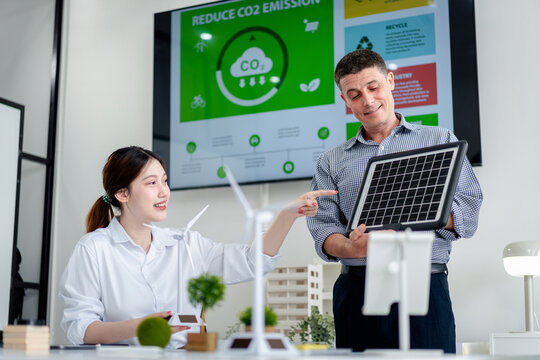 Sustainable Business Leaders Discussing Green Energy Solutions a