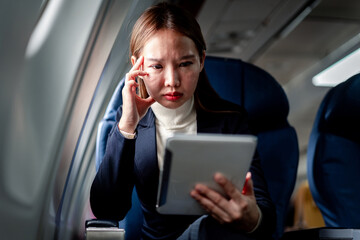 Focused businesswoman intense concentration using digital tablet © Freedomz