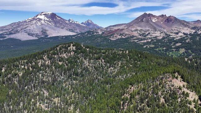 Rugged mountains rise from the Three Sisters Wilderness in Oregon. These scenic mountains are part of the Cascade Range and just 22 miles from Bend.