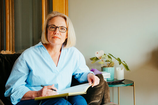 Middle aged woman looking questioningly at the camera. 