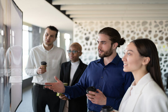 Young manager talking during video conference with colleagues 