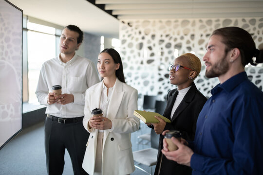 Multiracial coworkers having video call conference