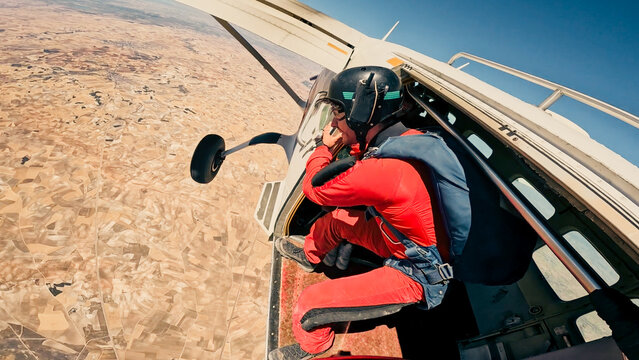 Parachutist waiting at the exit before freefall