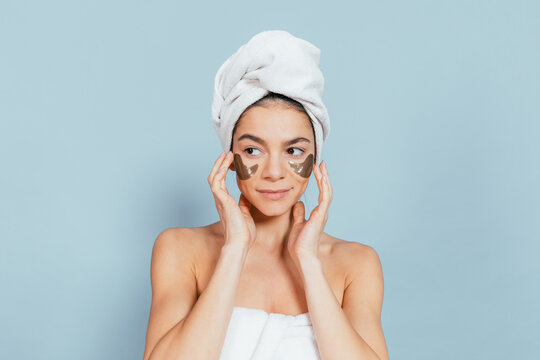 Relaxed woman enjoying spa treatment with eye masks