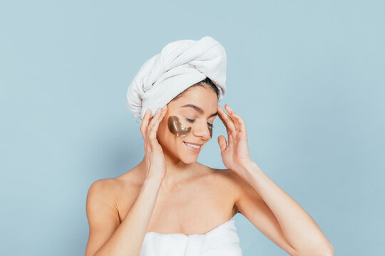 Calm woman applies eye masks