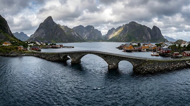Stone bridge over water leading to a coastal mountain village