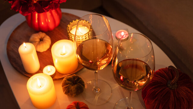 Cozy autumn evening with wine and candlelight ambiance