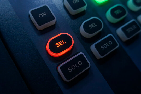 Illuminated audio mixer selection control buttons