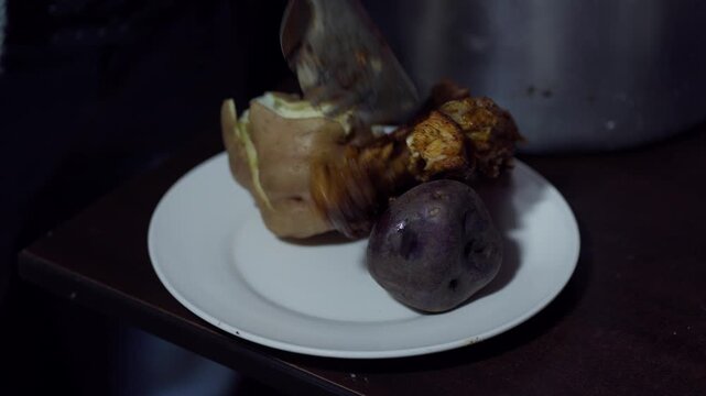 Close Up of Served Peruvian Pollada with Grilled Chicken Chorizo Sausage and Potatoes on Plate