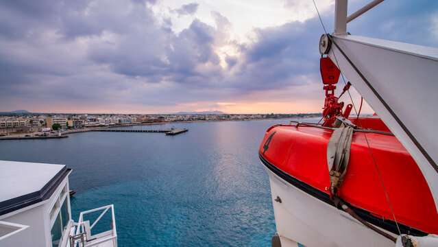Ferry sailing near Kos island at sunset with breathtaking coastal landscape