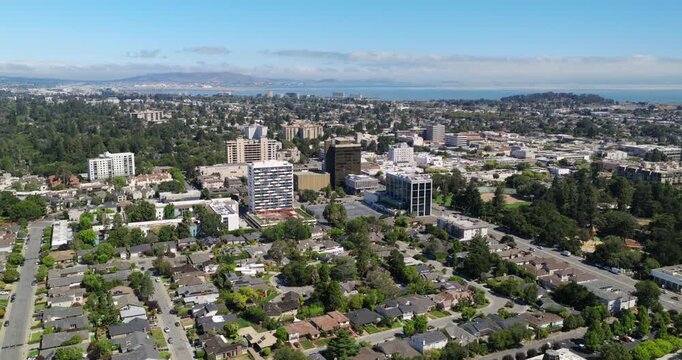 San Mateo California - Aerial Approach Over Homes Towards Downtown Facing North with SFO & San Francisco in Distance