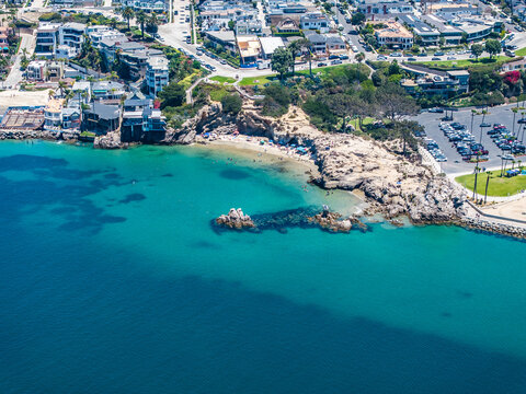 Aerial landscape view of Entrance Channel with Pirates Cove Beach next to Corona del Mar State Beach, located in Corona del Mar, a seaside neighborhood in the city of Newport Beach, California,