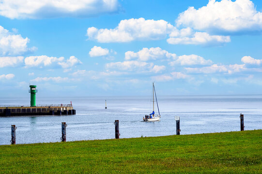 A sailing ship leaving the harbor of B&uuml;sum for the North Sea. 