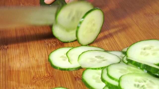 Cutting Cucumber slices panorama with dill on white background isolated