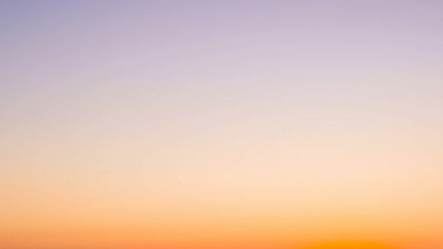 Shifting smooth sky gradient showing gradual desaturation at sunrise, caused by rising sun light