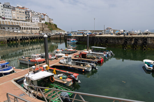 Malpica harbor with fishing boats and coastal village
