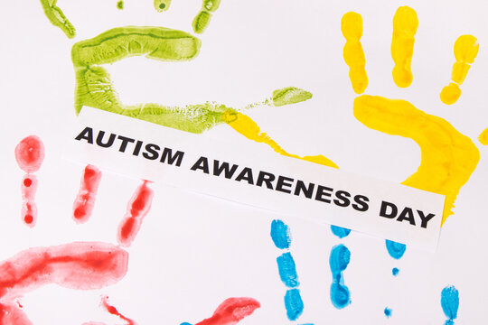 Kids handprint made of paint and inscription Autism Awareness Day. Autism Spectrum Disorder