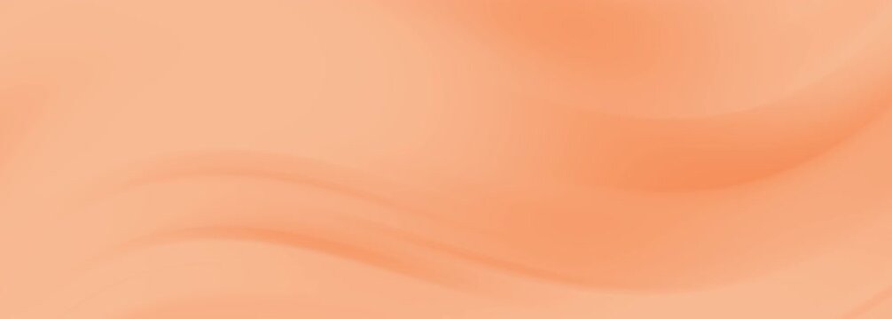 Soft orange fabric ripples creating gentle smooth waves light peach satin background textures.