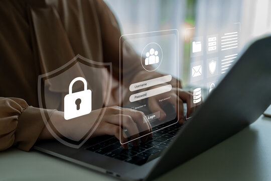 A focused woman types on a laptop in a modern workspace, showcasing security graphics and a login interface that represent digital protection and data privacy. Cyphers