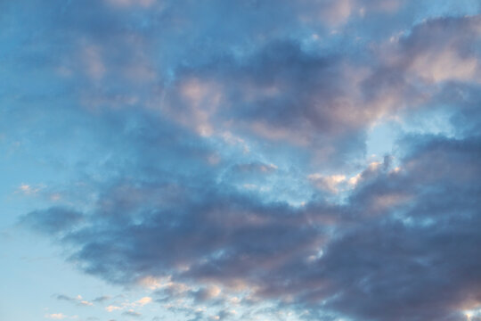 Majestic Cumulus Clouds Backlit by the Setting Sun