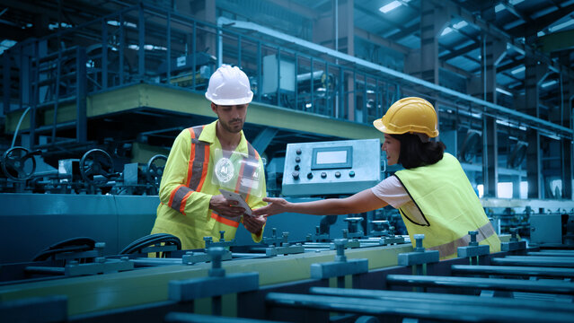 Ai using. Engineers and technicians use AI technology to inspect industrial machinery. Workers using Ai and augmented reality to optimize manufacturing process. Smart factory innovation. Industry tech