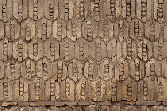 Decorative brickwork detail on the Kalyan Minaret in Bukhara showing geometric patterns of shaped clay bricks. Ideal for architecture, heritage, and travel publications.