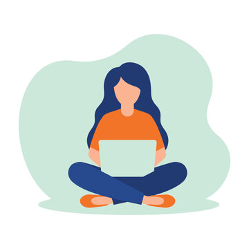 Woman sitting cross-legged with laptop on lap in front of green background