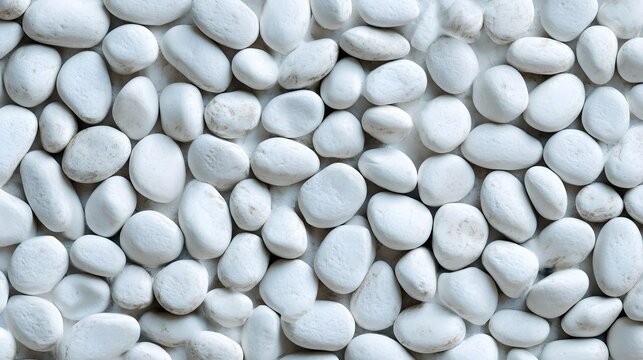 Smooth white decorative pebbles create a natural, calming texture background