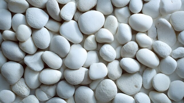 Smooth white decorative pebbles create a natural, calming texture background