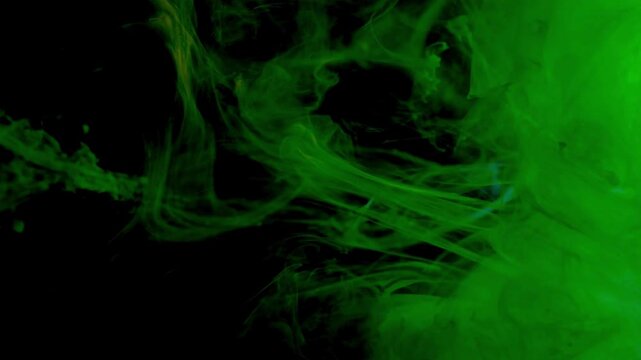 Vibrant orange ink swirling through deep green liquid creates a mesmerizing abstract slow motion effect showcasing fluid dynamics and artistic chemical reactions in high quality motion footage.