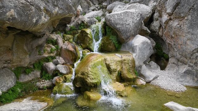 Stunning Waterfall with Turquoise Water Flowing Over Rocky Cliff in Nature