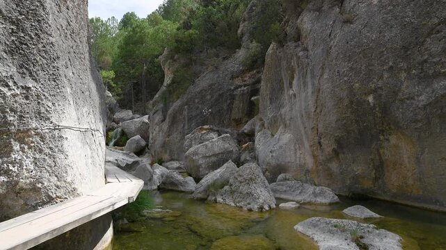 Hiking Adventure on Wooden Footbridges Over Pure Turquoise Water