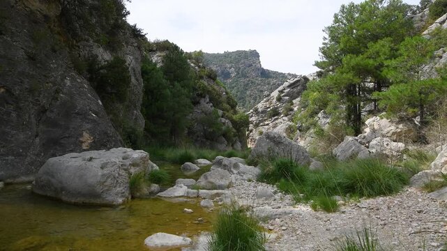 Majestic El Parrizal de Beceite Nature Trail with Turquoise River and Rocky Gorge