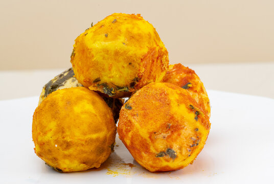 araffy bowl of cheese balls with herbs