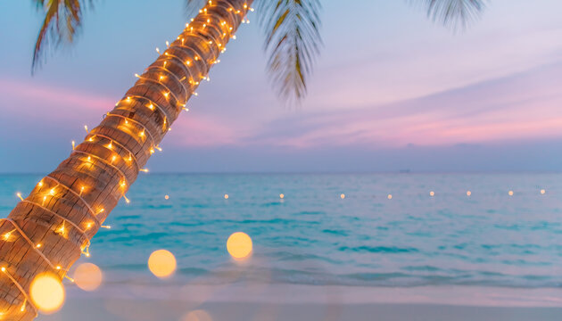 Palm tree wrapped in fairy lights on tropical beach at sunset