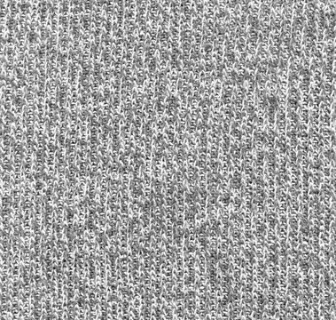 Gray and white heathered cotton knit fabric texture. Close-up of knitted sweatshirt material surface